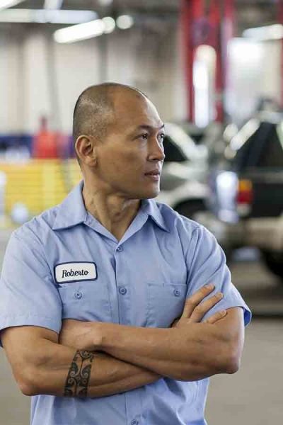 Services-portrait-of-pacific-islander-car-mechanic-in-auto